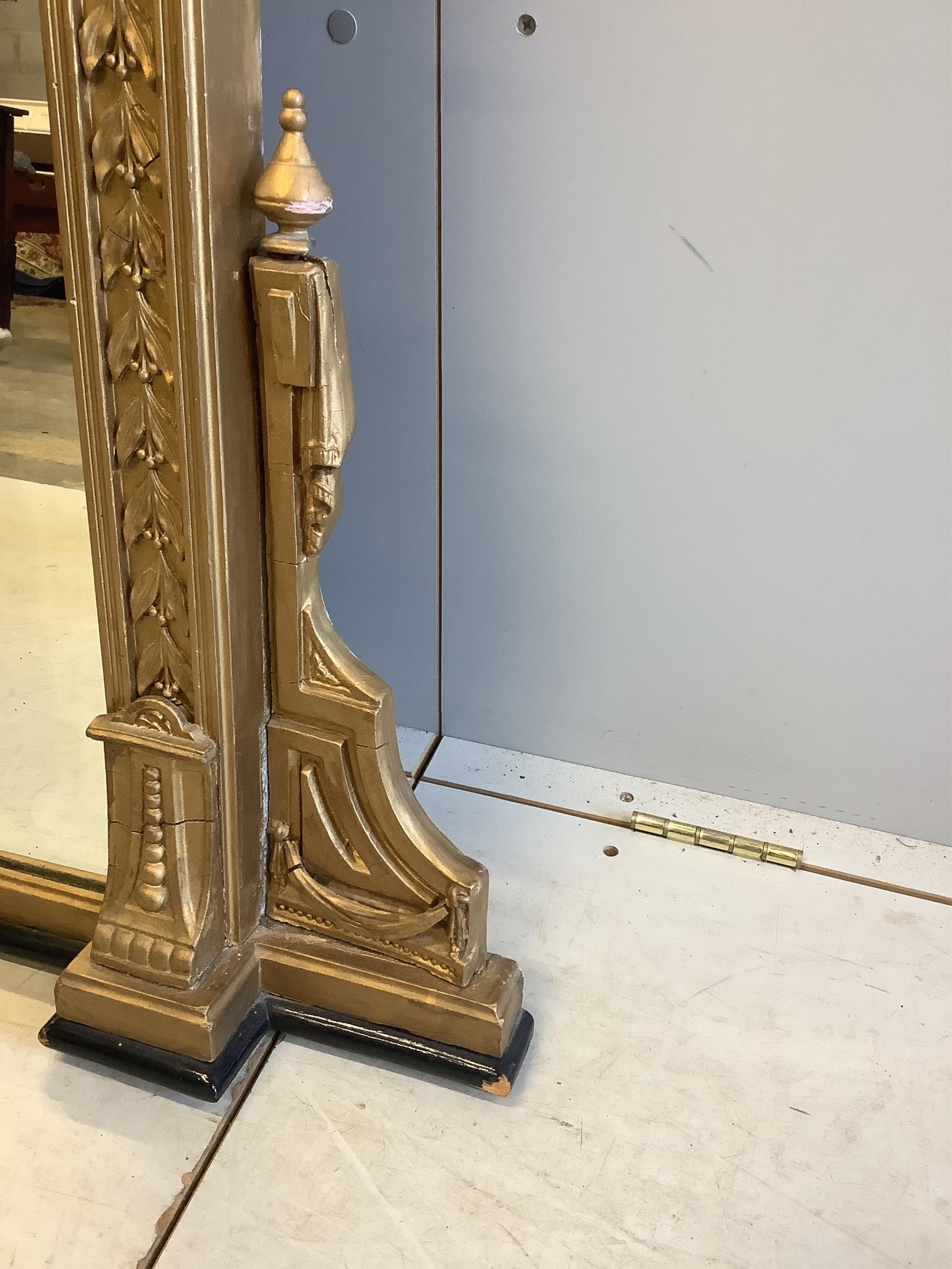 A Victorian giltwood and composition overmantel mirror, width 146cm, height 160cm. Condition - fair, re-gilded